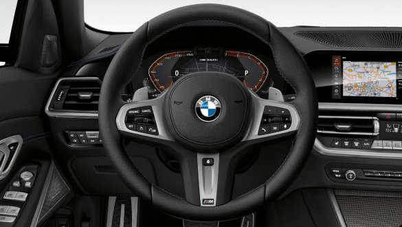 Адаптивне спортивне рульове керування BMW М340і xDrive Седан G20 2020. Адаптивне спортивне рульове керування BMW M340i xDrive Седан G20 2020 у кольорі Sapphire Black metalic, кокпіт, інтер’єр.