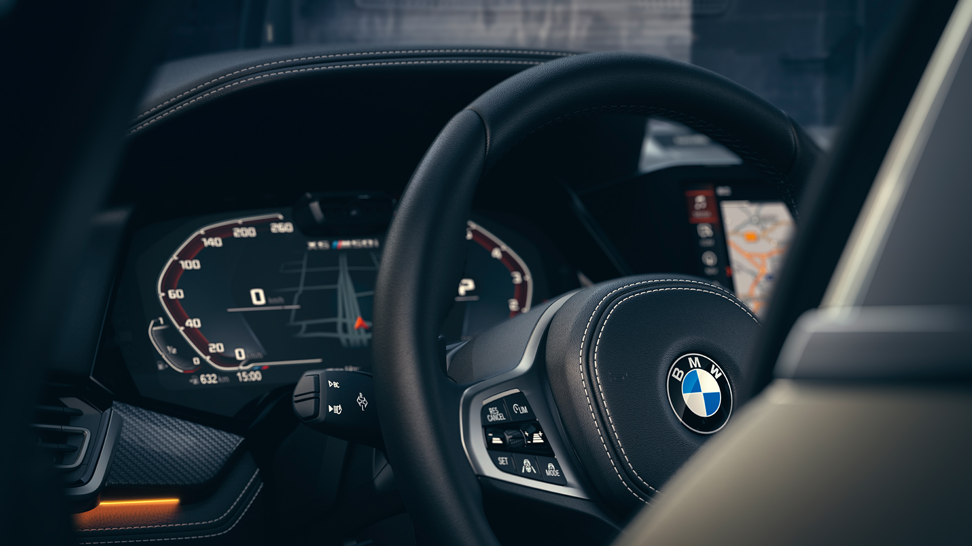 Системи допомоги BMW. Крупний план салону BMW з акцентом на приладову панель.